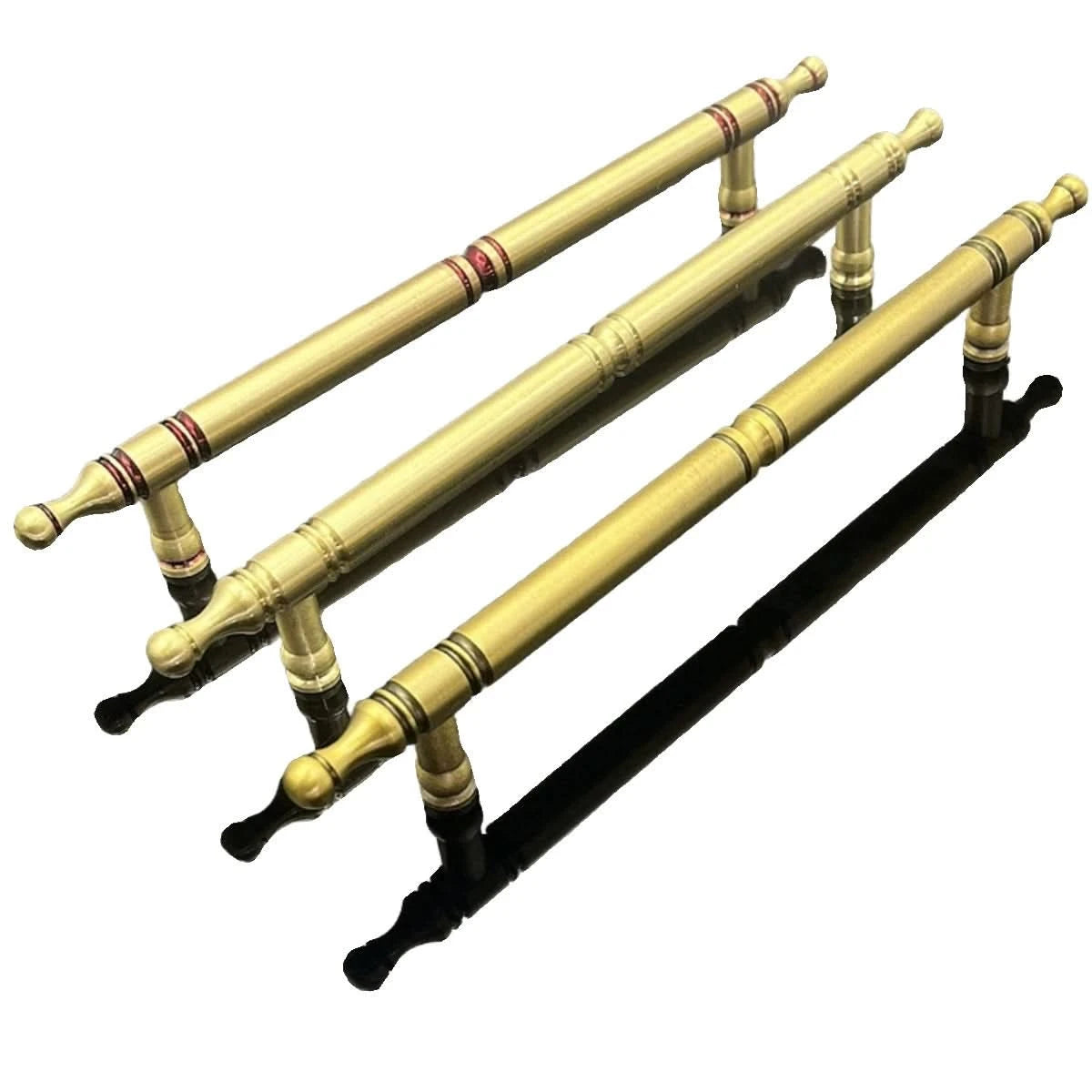 Three classic solid brass cabinet handles with ornate detailing, perfect for home decor.